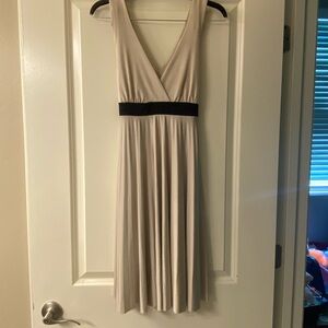 Chic Sleeveless Cream Dress with Black Waistband